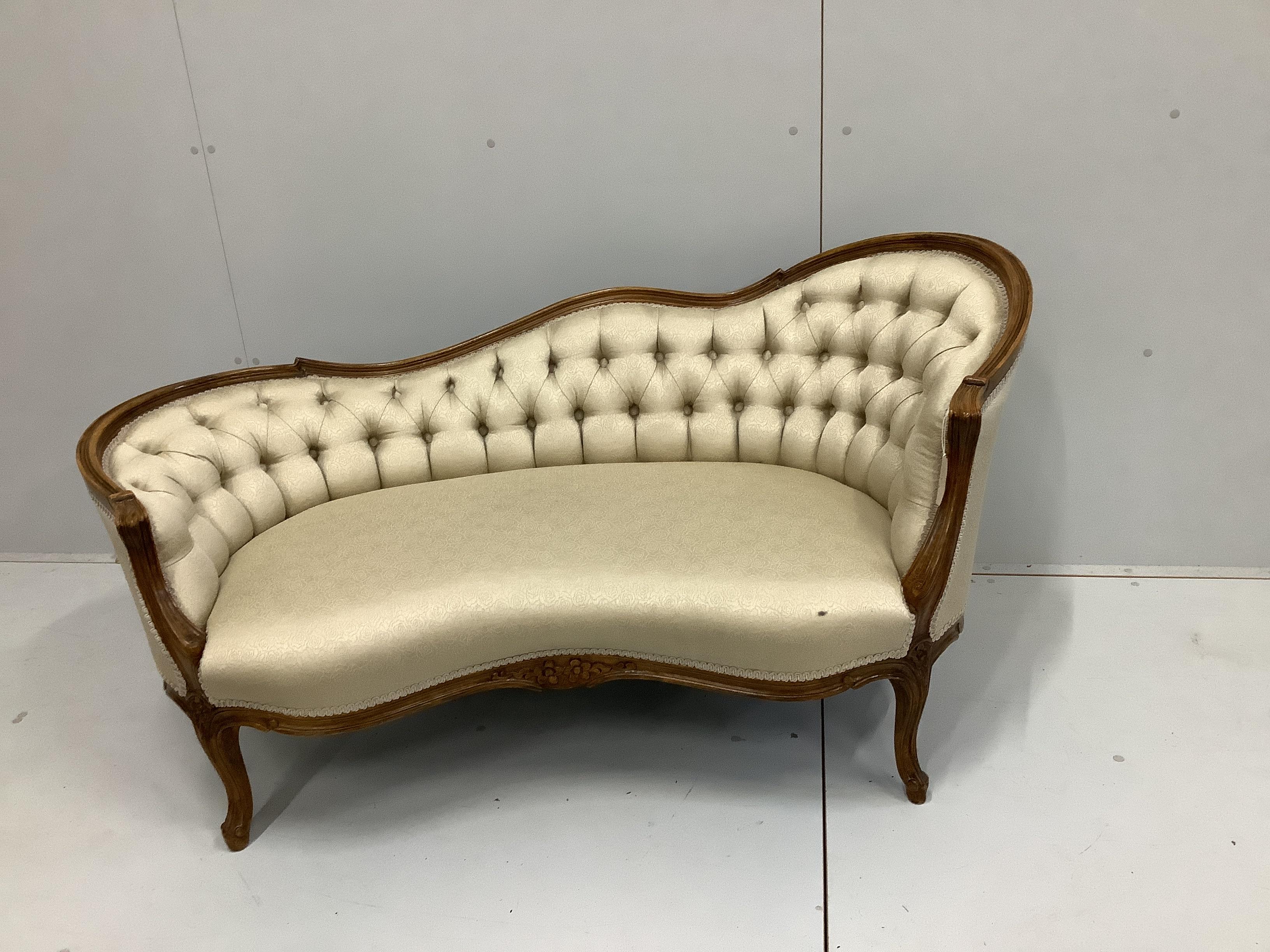 An early 20th century Louis XVI style beech button back show-wood couch, with carved and moulded frame, on cabriole legs, width 151cm, depth 70cm, height 73cm